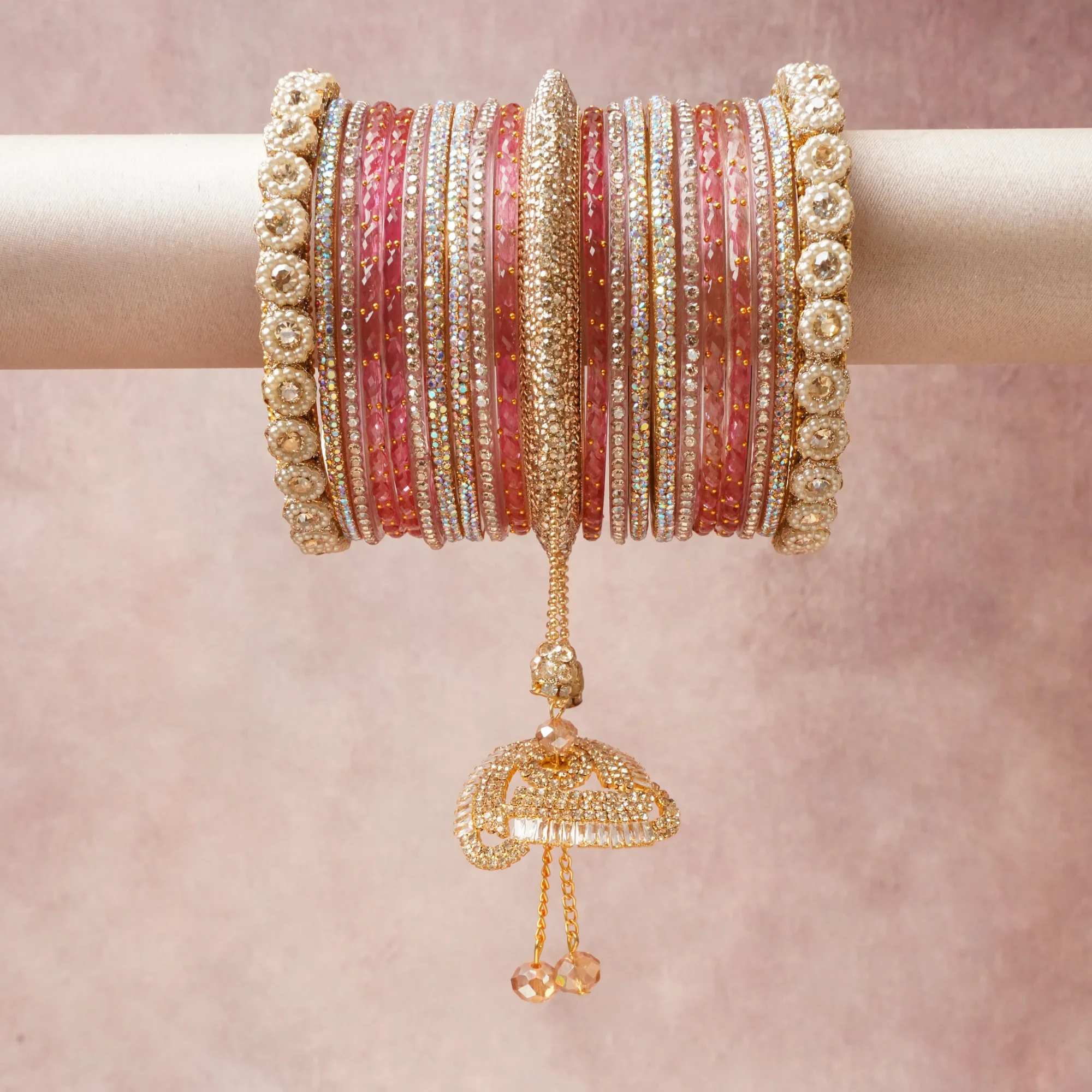 A commanding Rose Pink anchors this beautiful set, enriched with accents of Cream Pearl, Bright Gold, Peach Crystal that add depth and dimension.

Featuring a striking composition of Glass, Gold-Plated Metal, Crystals, Pearlized Beads, this set carries intricate craftsmanship and strong presence. Grand in form, it is created for moments that deserve to be marked.
